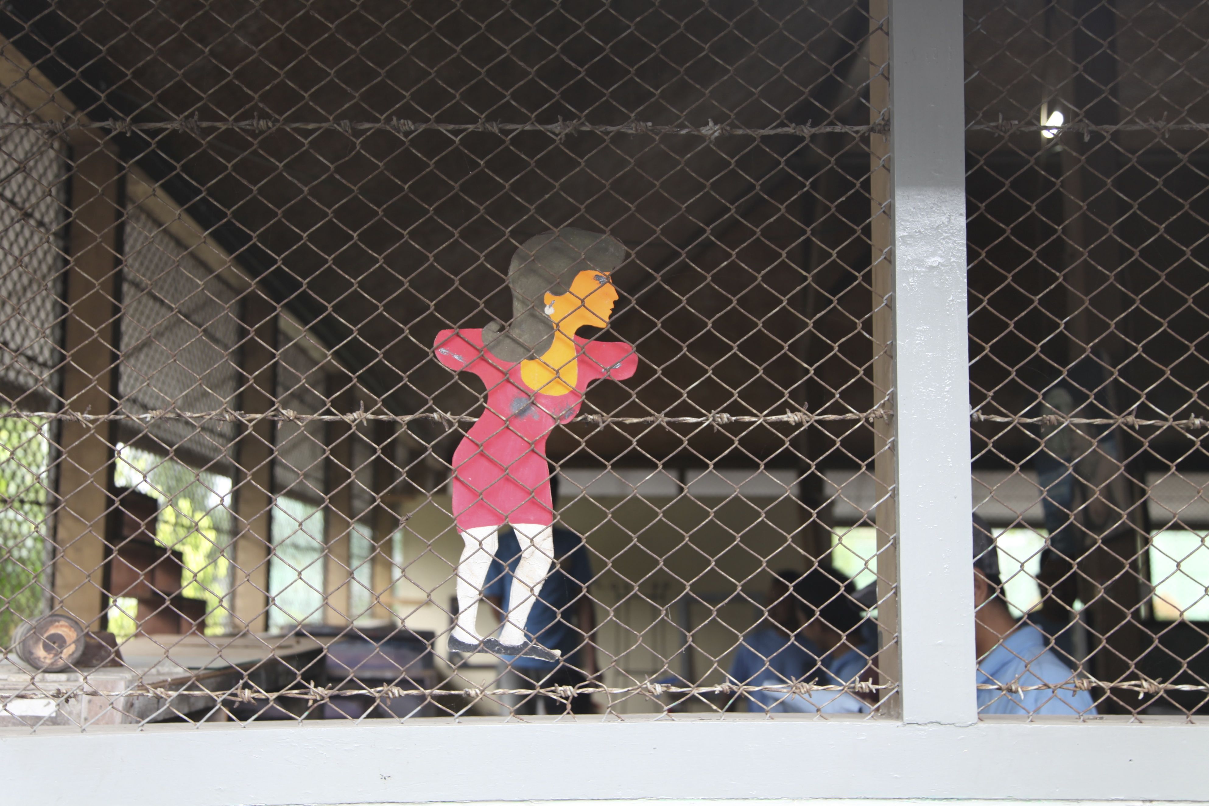 Caption: A stencil of a woman adorns the men’s workshop at Wirogunan prison, reminding inmates of the outside world -  Nikki Edwards Incarceration in Indonesia