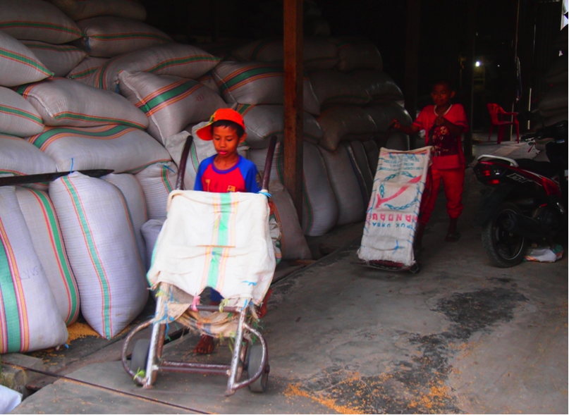 Working in a rice mill, South Sulawesi - Charina Chazali